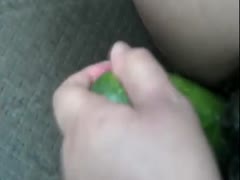 Kinky babe using cucumber as a dildo